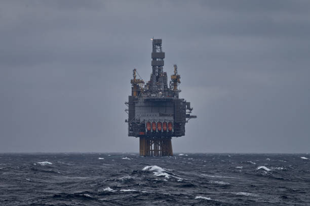 picture of offshore oil and gas drilling rig in the sea in stormy weather. - oil rig storm jackup oil industry imagens e fotografias de stock