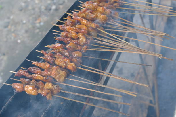 istock Sate Ambal is a chicken satay typical of the Kebumen area of Central Java. This satay is made from chicken meat seasoned with spices. Sate is cooked by grilling on a charcoal grill. Indonesian food. 1944809313