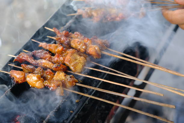 istock Sate Ambal is a chicken satay typical of the Kebumen area of Central Java. This satay is made from chicken meat seasoned with spices. Sate is cooked by grilling on a charcoal grill. Indonesian food. 1944809321