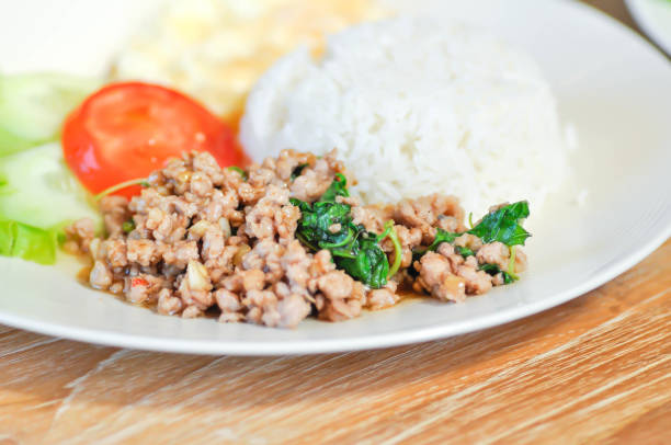 stir fried pork with holy basil and sunny side up egg or fried egg or Thai food