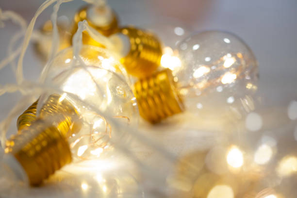 istock Bright light bulb lamps shining on close up still 1944811421