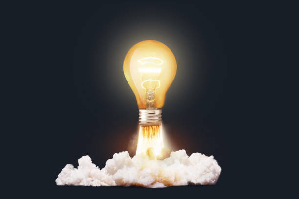 istock Creative light bulb rocket with blast and clouds takes off on a dark background, concept. Successful launch start up, creative idea. Think differently. Creative generator. Smart and thinking 1944821407