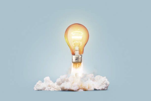 istock Creative light bulb rocket with blast and smoke takes off on a blue background, concept. Successful launch and development, creative idea. Think differently. Creative generator. Smart and thinking 1944825212