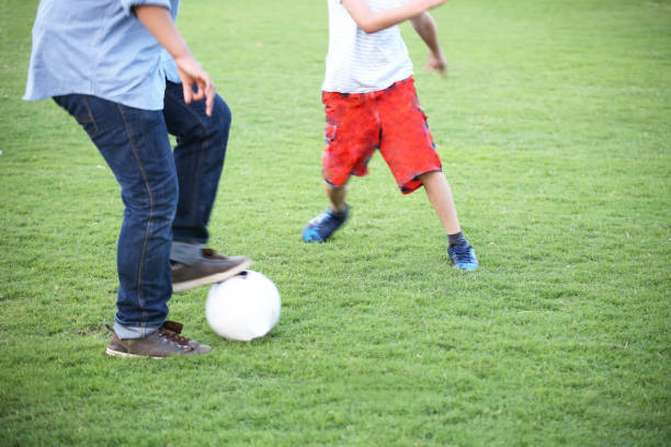 istock Kids Running After Soccer Ball 1944829650