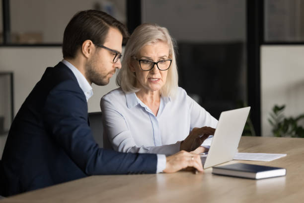 istock Focused senior business professional complaining on laptop 1944837210