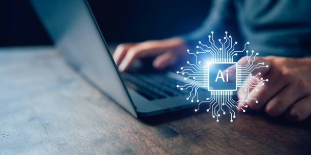 istock Businessperson using laptop with AI (Artificial Intelligence) concept hologram, representing modern technology and innovation. 1944859859