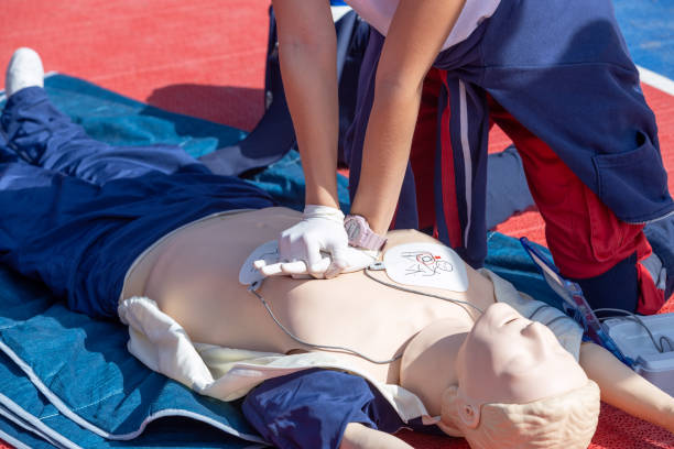 istock CPR - Cardiopulmonary resuscitation and first aid course using Automated External Defibrillator - AED 1944866375