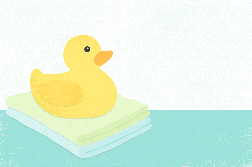 A yellow rubber duck and folded washcloths, in a cut paper style with textures
