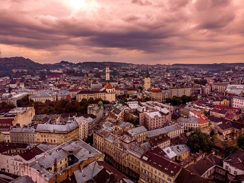 An aerial view of Lviv's historic cityscape at dusk, with a tapestry of vibrant, ancient buildings