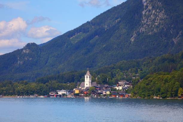 Scenic mountain lake view of the charming lakefront town St. Wolfgang im Salzkammergut in the Dachstein alps range in Austria.