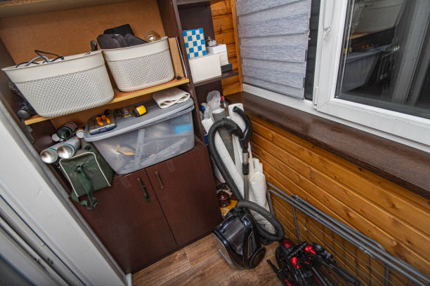 trash and disorder of unnecessary things from the storage area in a container located on the balcony and loggia of the apartment