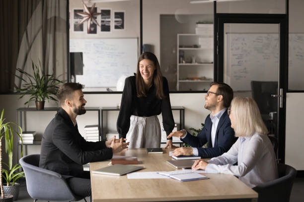 istock Happy young project manager holding teamwork meeting with colleagues 1944906042