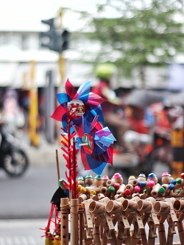 Yogyakarta, Indonesia - September 18, 2022 : Wooden dolls and souvenirs at Malioboro Street, Yogyakarta, Indonesia