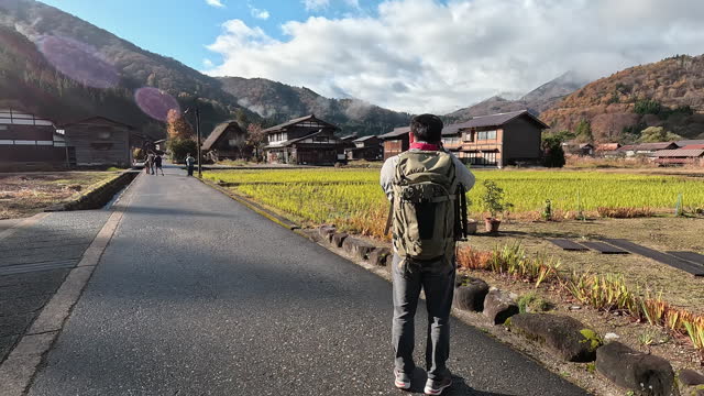 Asian Traveler enjoy take photo in  in Shirakawago Village. Travel destination landmark in Japan.