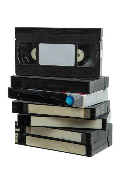 pile of vhs video cassettes. vintage media. isolate on a white background. - vcr video cassette tape video television foto e immagini stock