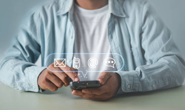 istock Businessman using Smart Phone with Customer support hotline Contact us people connection. the email, call phone, address, Chat message icons. 1944953097