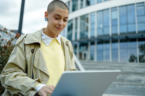 istock Business Woman Using Laptop Outdoors 1944966176