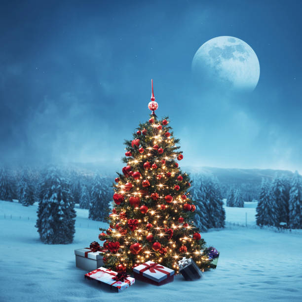 istock Wintry landscape, decorated Christmas tree and gifts 1944971499