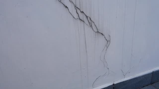 Visible cracks on a white wall. Uttarakhand India.