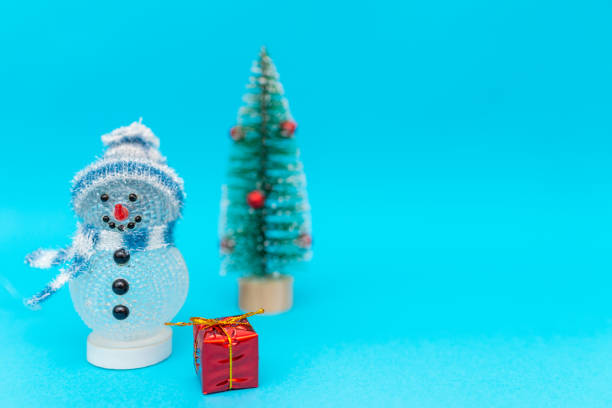 istock Toy snowman, presents and Christmas tree with copy space.new year celebration. 1944972550
