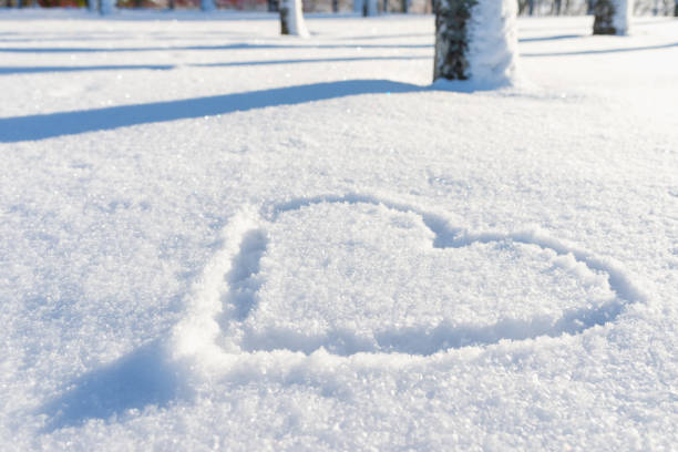 istock Nice heart shape on the fresh snow winter lanscape,park or forest. 1944984032