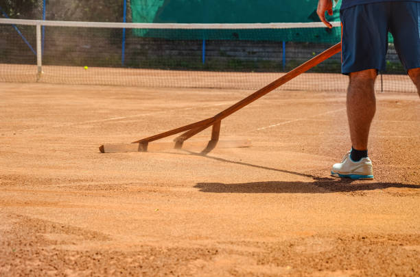 istock Cleaning up tennis court 1944993590
