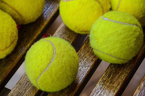 Tennis equipment on the seat waiting to be used