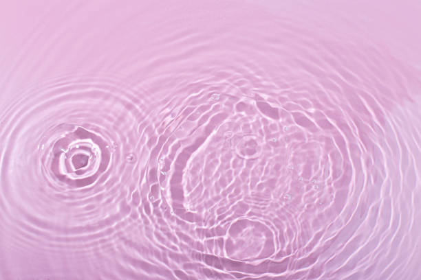 istock pink wave abstract or rippled water texture background 1945003842