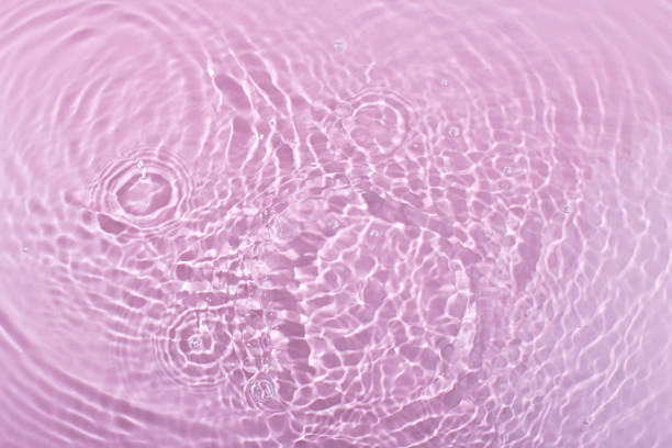 istock pink wave abstract or rippled water texture background 1945003843