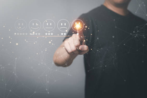 istock Business people press the sad face emoticon on the virtual reality touch screen, Customer service evaluation concept. Review and put a check mark. That the score is not very impressive. 1945008609