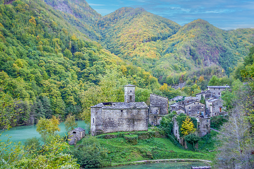 small unhabited village of Isola Santa in the Tuscany between the Apuan Alps, located on the shores of an emerald lake, Italy