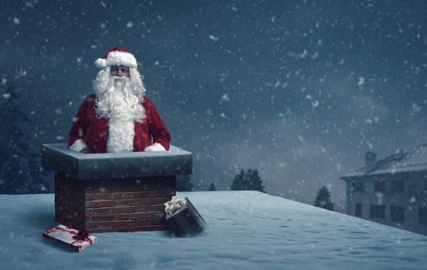 istock Funny Santa Claus stuck in a chimney 1945026008
