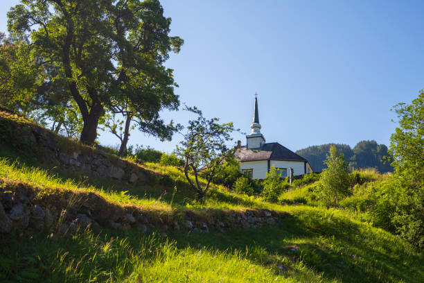 geiranger church, which dates back to 1589, photographed during a clear summer day. - scandinavian church front view norway imagens e fotografias de stock