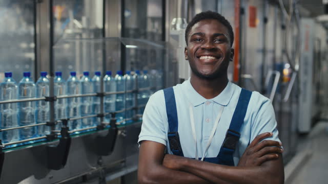 Portrait of Happy Smiling Engineering Technician at Mineral Water Plant