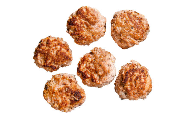Roasted cutlets from beef and pork meat.  Isolated on white background, Top view