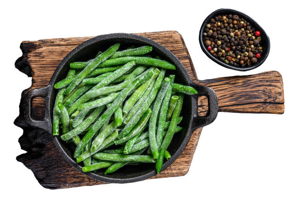 istock Frozen green beans in a pan.  Isolated on white background, Top view. 1945056462