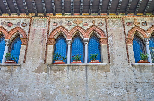 Treviso, Italy,  the three-lancet windows of aa medieval house in the old town