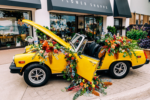 Wallaceburg, Canada – August 20, 2022: Parked vehicle adorned with floral arrangement on the hood