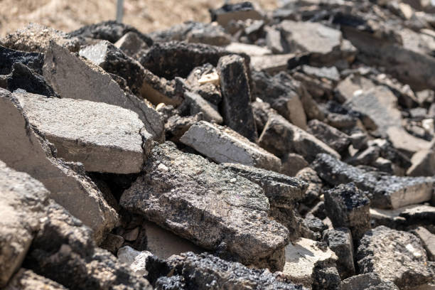 istock torn up road with chunks of tar 1945086308