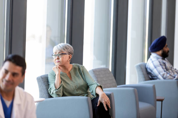 istock Mature female sits quietly in the lobby 1945090661