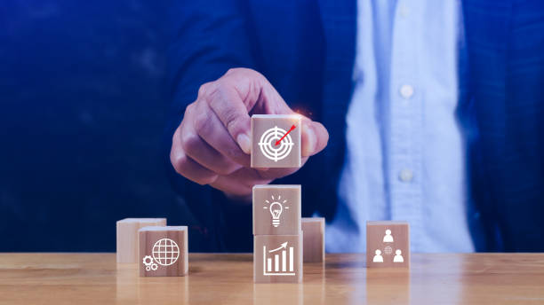 istock Hand arranging wood block stacking with business strategy and Action plan, targeting the business concept. Business development concept. Goal plan action. 1945122568