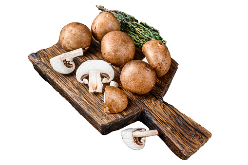 Cut Raw Royal brown champignon mushrooms.  Isolated on white background, Top view