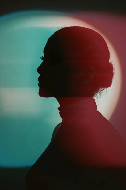 istock Woman profile black silhouette portrait in RGB color split effect style 1945145589