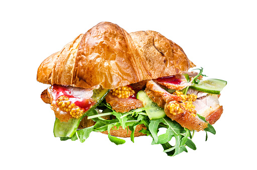 Croissant sandwich with cheese, arugula and ham. Isolated on white background, Top view