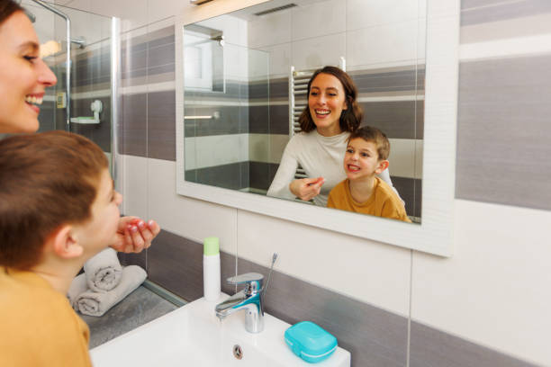 istock Mother Washing Her Son's Face 1945170327