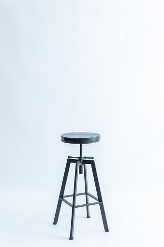 Black metal stool with wooden seat