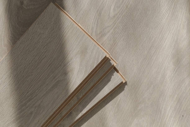 istock Laminate vinyl floor, home improvement, new floor installation 1945177083