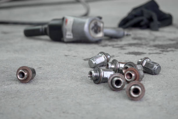 istock Removed car wheel nuts Placed on concrete floor 1945215156