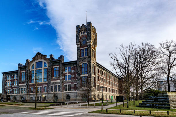 istock Old main building of former Waterschei mine against blue sky background 1945222907