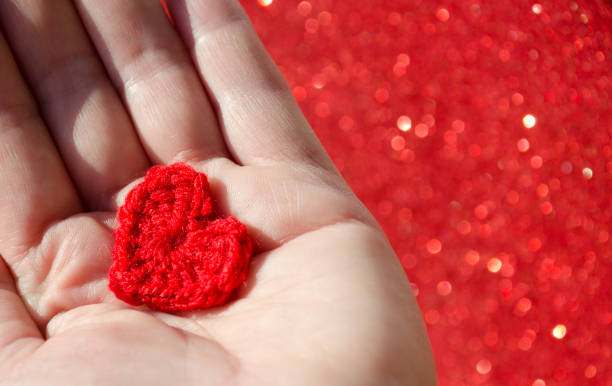 istock Heart in a boat for Valentine's Day on a blurred shiny background. 1945227100